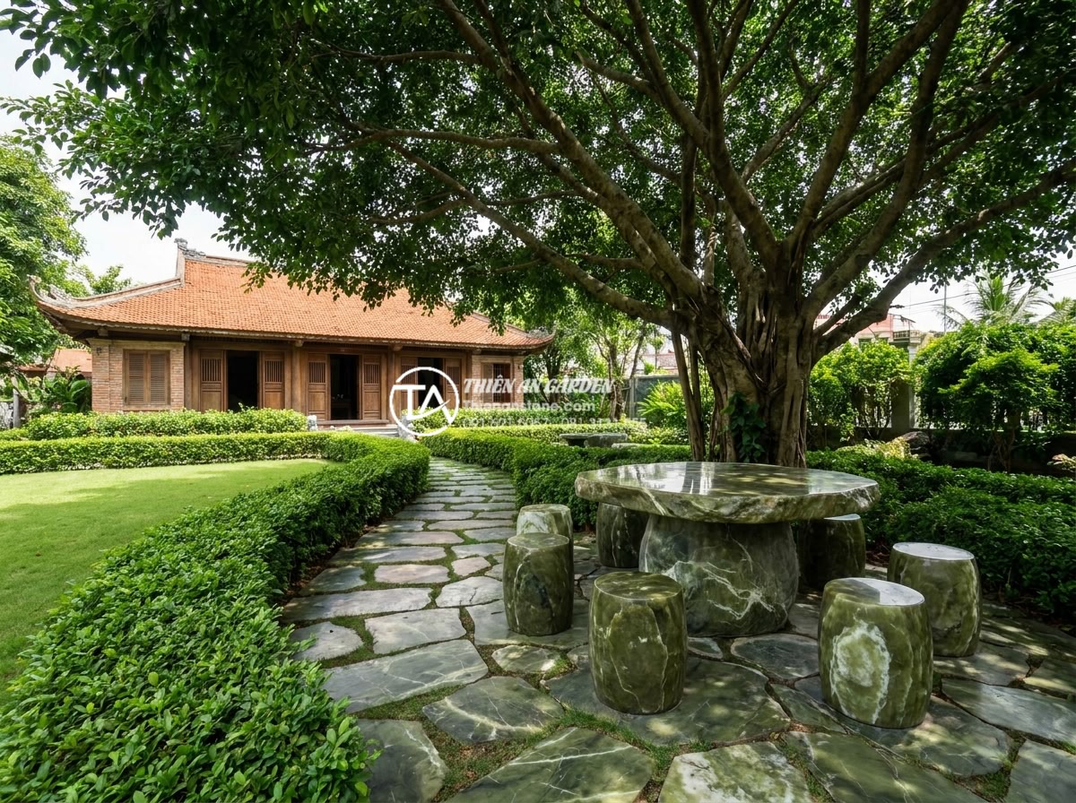 Bàn Trà Đá Nguyên Khối - Luxury villa garden with a central solid stone tea table and matching stone stoo