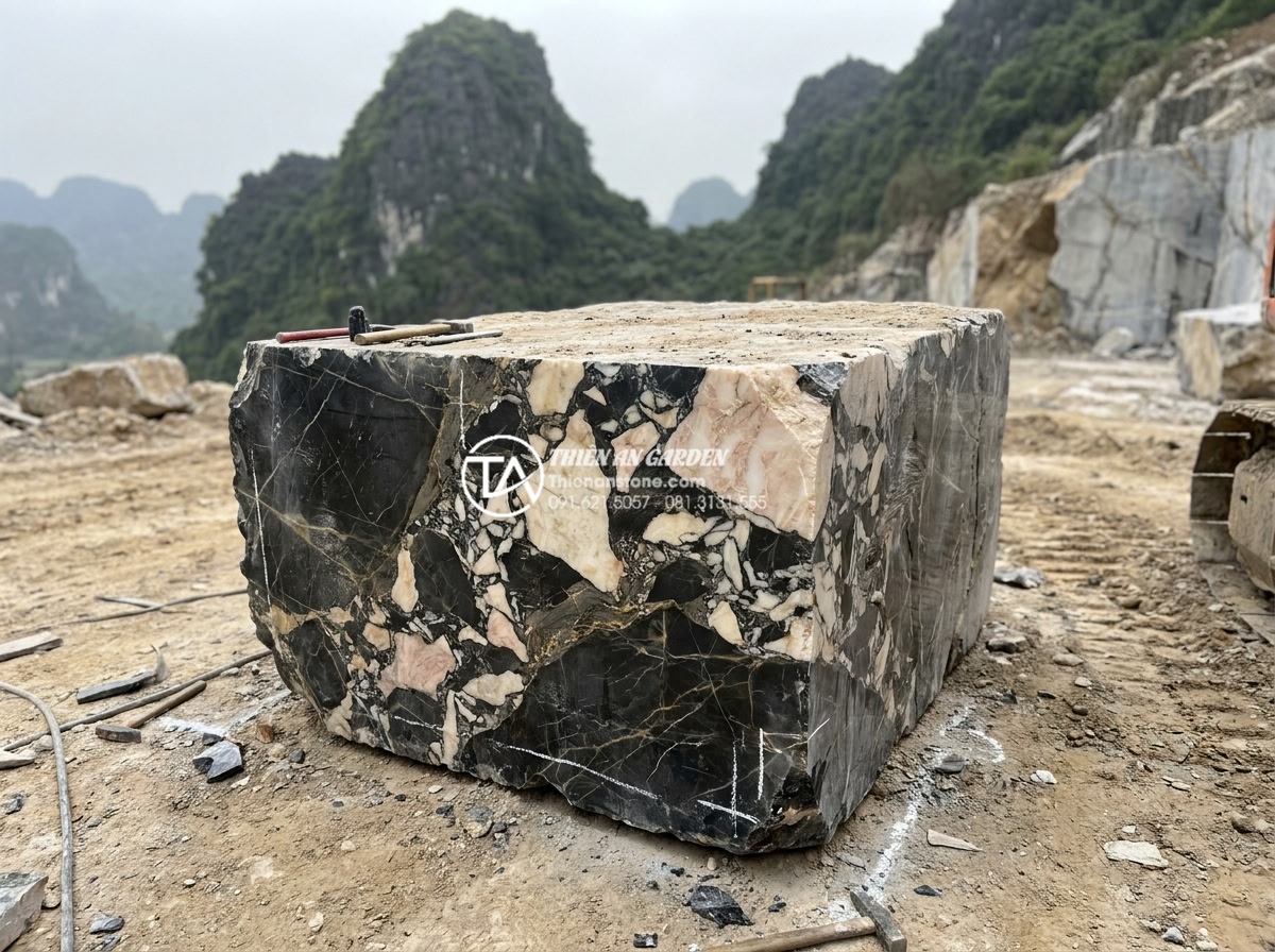 Bàn Trà Đá Nguyên Khối - Raw natural stone block being carefully selected at a quarry site in Vietnam, wo