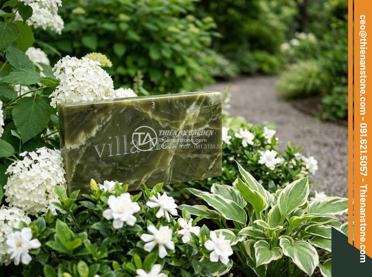 Bảng Hiệu Đá Tự Nhiên - Small elegant natural stone sign reading villa name, set among white flowers and