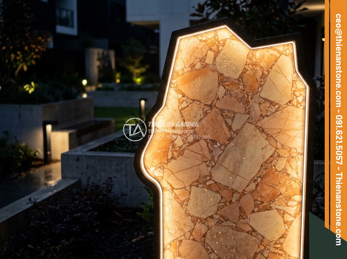 Bảng Hiệu Đá Tự Nhiên - Backlit natural stone sign at night creating glowing silhouette effect, modern l