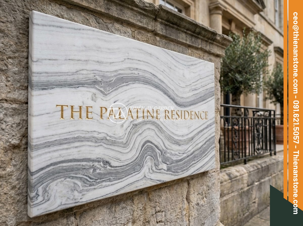 Bảng Hiệu Đá Tự Nhiên - White marble sign board with elegant grey veining at luxury boutique hotel entra