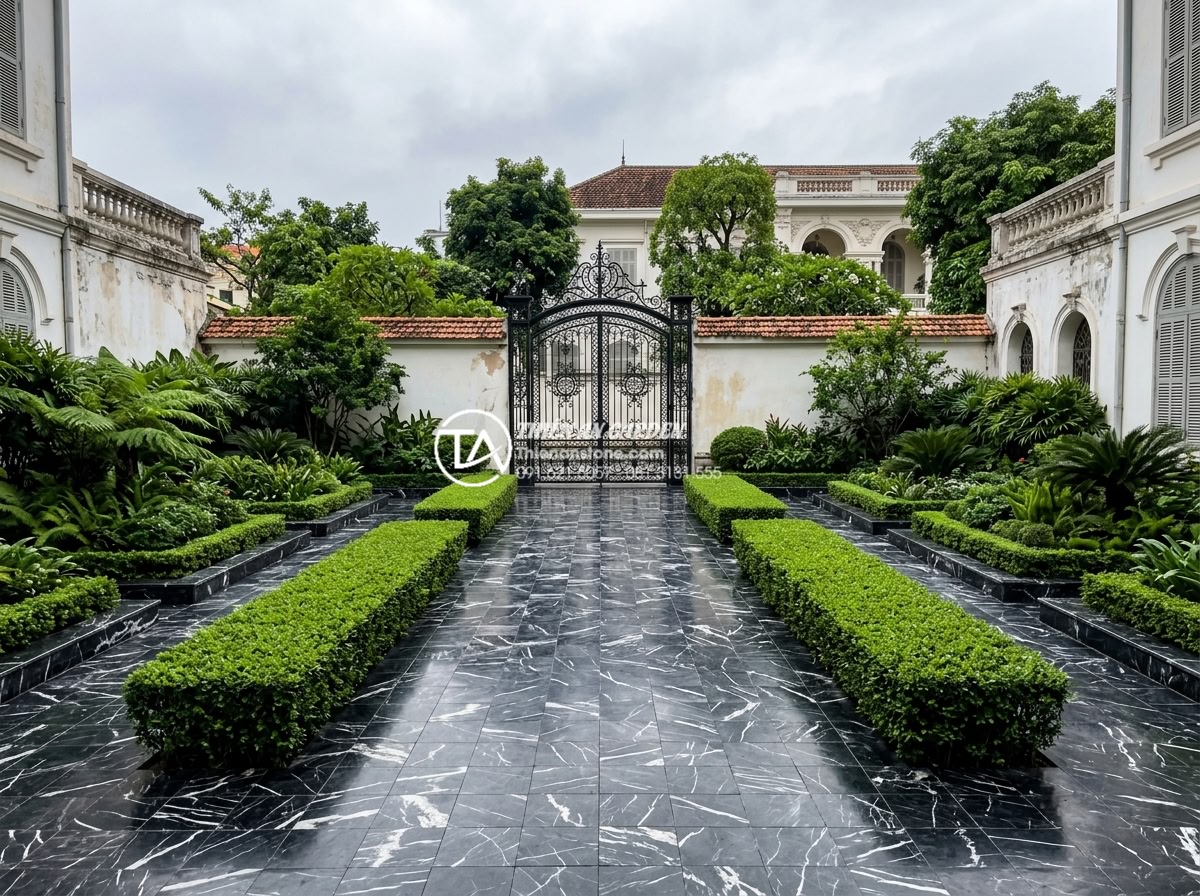 Đá Cubic Lát Sân - Wide shot of a completed courtyard with cubic stone paving, symmetrical garden d