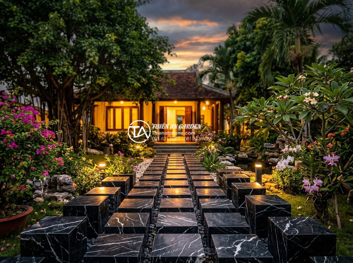 Đá Cubic Lát Sân - Warm inviting garden entrance at sunset with cubic stone pathway leading to illu