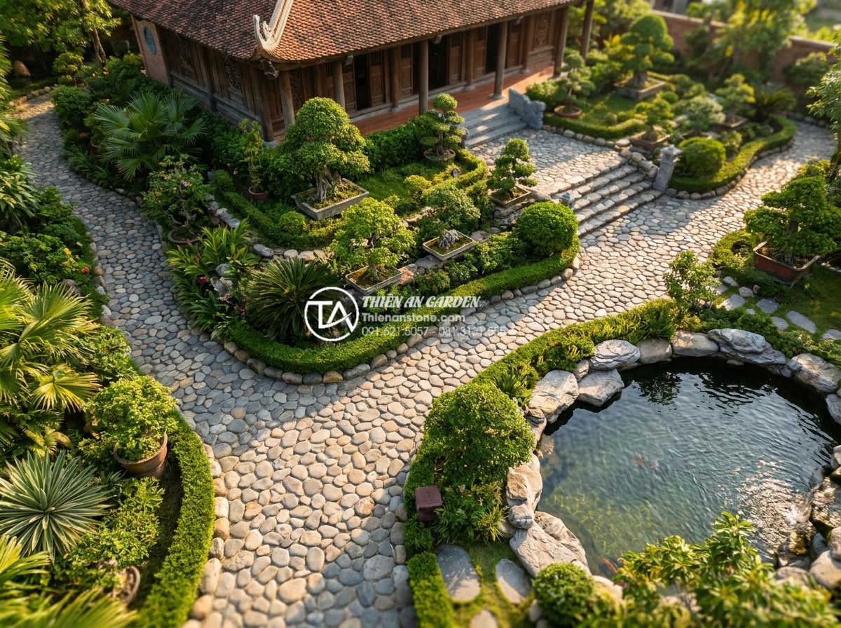 Đá Cuội Suối - Aerial view of a luxury villa garden with river pebble pathways winding through 