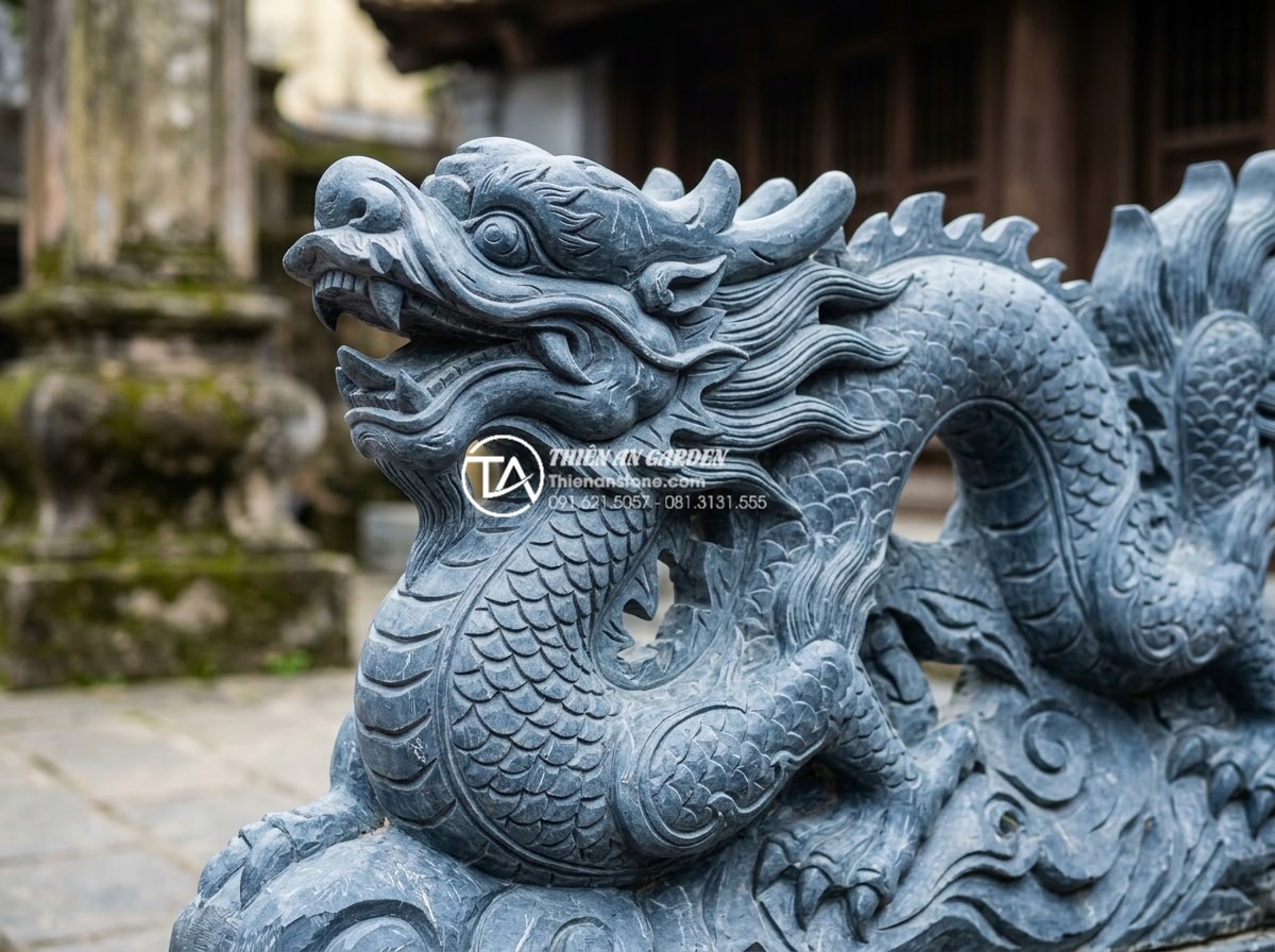 Đá Mỹ Nghệ - Close-up shot of intricate dragon carving detail on natural blue stone sculpture