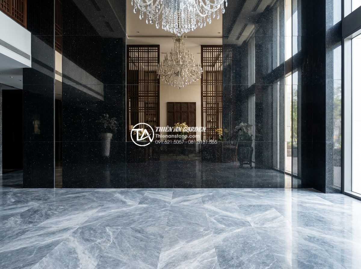 Đá Ốp Tường - Hình 13 Đá Ốp Tường - Polished black granite wall cladding in a luxury hotel lobby, reflective surface