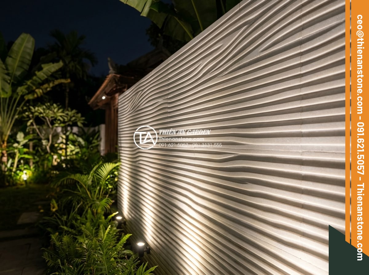 Đá Răng Lược - Hình 41 Đá Răng Lược - Comb stone wall at night with professional landscape lighting, warm uplights cre