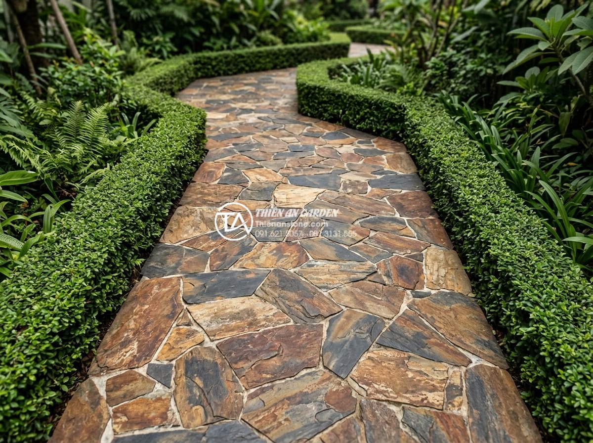 Đá Rối - Hình 13 Đá Rối - Bush hammered random stone paving in outdoor garden walkway, even rough texture