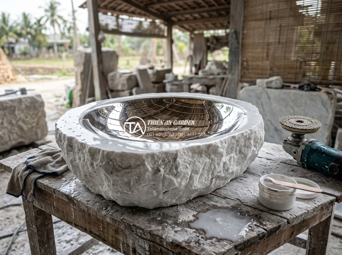 Lavabo Đá Tự Nhiên - Final polishing stage of natural stone lavabo basin, craftsman applying final po
