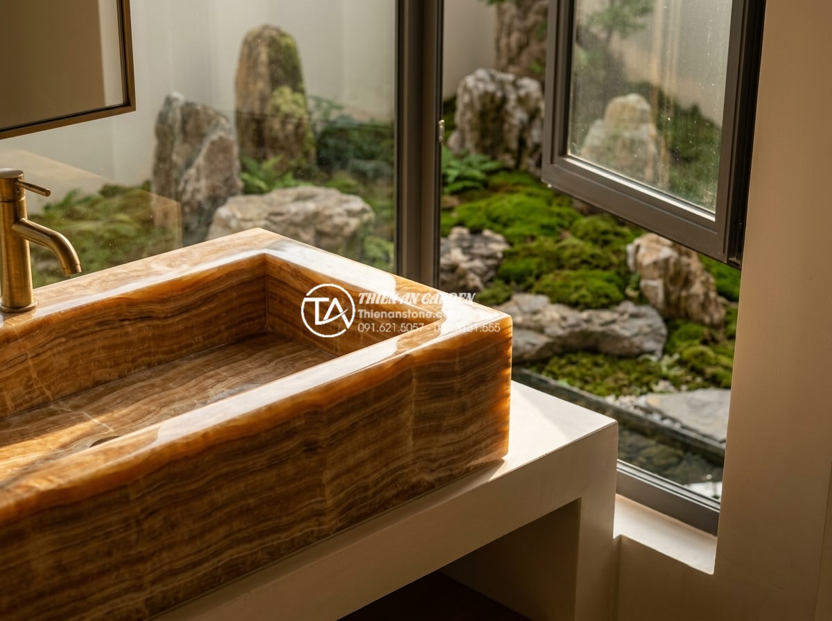 Lavabo Đá Tự Nhiên - Detail vignette of natural stone lavabo with bathroom window view overlooking Ze