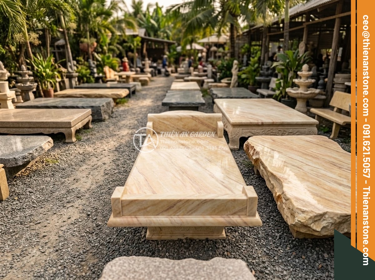 Sập Đá - Hình 29 Sập Đá - Collection of different sized and shaped natural stone daybeds displayed in outd