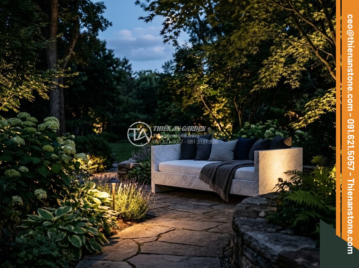 Sập Đá - Hình 38 Sập Đá - Dramatic evening garden lighting highlighting natural stone daybed, multiple lig