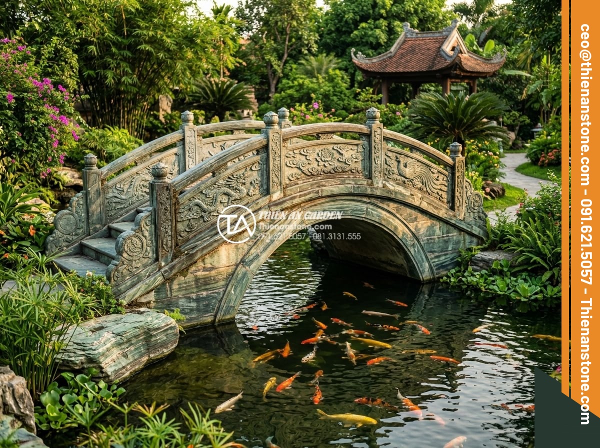 Thiết Kế Sân Vườn - Elegant natural stone bridge arching over a koi pond in a luxury Vietnamese gard
