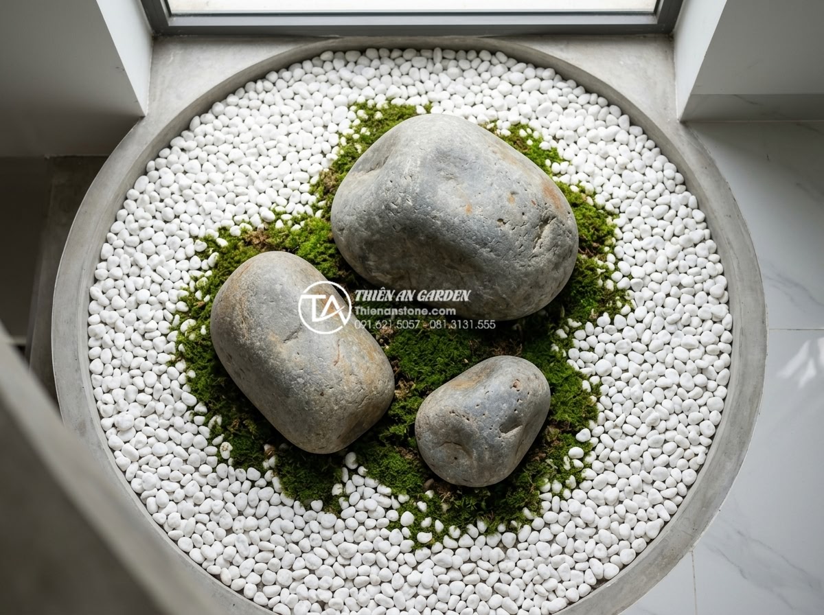 Tiểu Cảnh Giếng Trời - Top-down view of a triangular stone arrangement in a skylight miniature garden, 