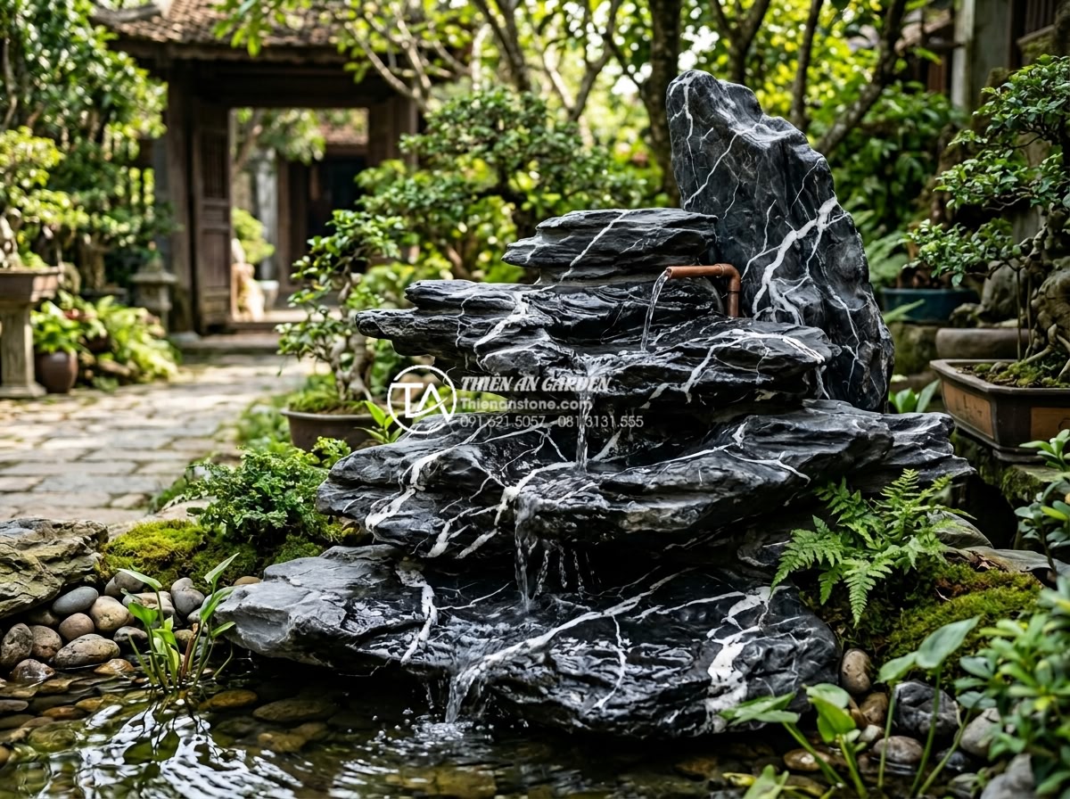 Cách lắp đặt hệ thống máy bơm mini cho tiểu cảnh chú tiểu thác nước - Finished pipe and nozzle system integrated seamlessly into layered natural stone