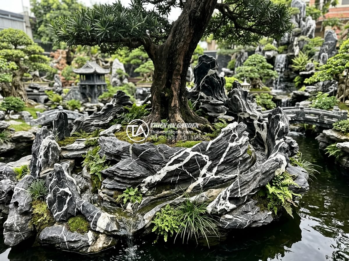 Case Study: Cải tạo góc sân vườn 20m2 với tiểu cảnh gốc cây Tùng La Hán - Detailed view of finished stone carving arrangement technique creating natural f