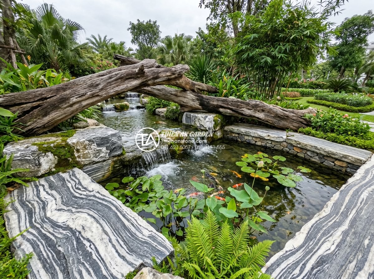 Hồ sơ năng lực: Case study dự án tiểu cảnh gỗ lũa tại Vinhomes - Wide view of the integrated stone and driftwood water feature at Vinhomes with g