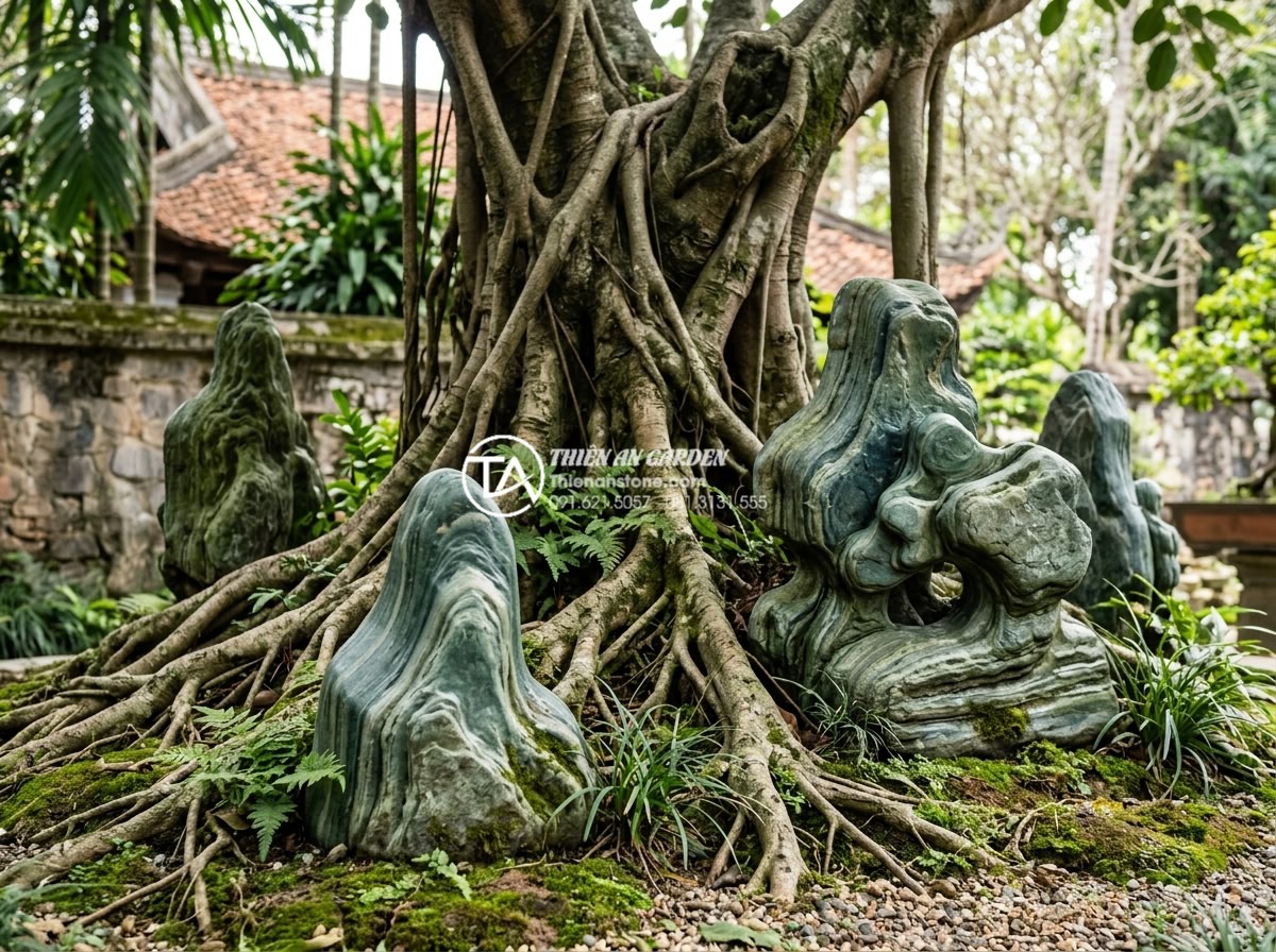 So sánh tiểu cảnh gốc cây phong cách Nhật Bản và phong cách Việt Nam - Hình 12 So sánh tiểu cảnh gốc cây phong cách Nhật Bản và phong cách Việt Nam - Cultural Vietnamese tree base landscaping with feng shui stone carvings represen