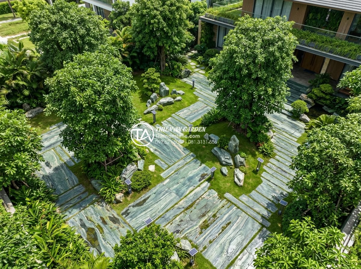Sử dụng đá thấm thủy trong tiểu cảnh gốc cây: Tại sao là lựa chọn số 1? - Aerial view of a luxurious sustainable villa garden in Vietnam with multiple lar