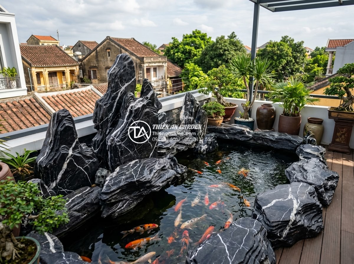 99+ Mẫu tiểu cảnh sân thượng đẹp và hiện đại nhất xu hướng 2026 - Detailed non-bo rockery with koi fish pond using carved natural stones on modern