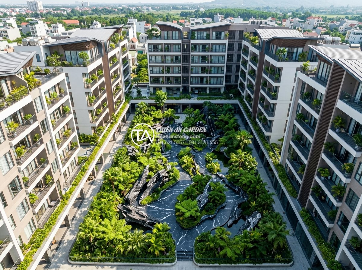 Có nên làm tiểu cảnh giếng trời chung cư? Lưu ý quan trọng từ chuyên gia - Hình 6 Có nên làm tiểu cảnh giếng trời chung cư? Lưu ý quan trọng từ chuyên gia - Aerial drone shot of an entire condominium complex highlighting the central ligh