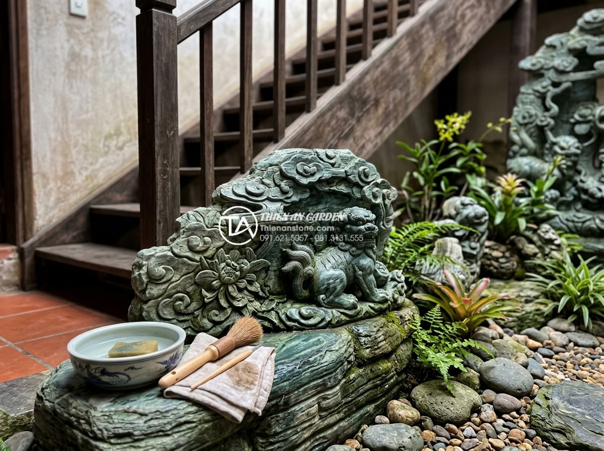 Dự toán chi phí duy trì và bảo dưỡng tiểu cảnh gầm cầu thang hàng tháng - Expert hand-cleaning of intricately carved stone sculptures in under-stair decor