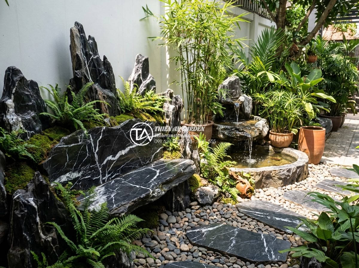 Lựa chọn đơn vị thiết kế thi công tiểu cảnh góc sân vườn uy tín - Hình 4 Lựa chọn đơn vị thiết kế thi công tiểu cảnh góc sân vườn uy tín - Eco-friendly garden corner using sustainable natural stones, plants, and water f