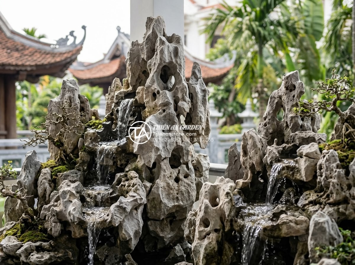 Mẫu tiểu cảnh ban công kết hợp thác nước bằng đá tự nhiên cực sang trọng - Branding image of Da Canh Thien An company showcasing completed luxurious natura