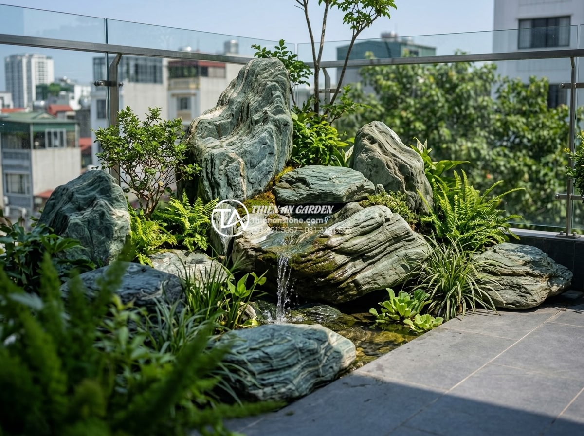 Review 5 đơn vị thi công tiểu cảnh sân thượng uy tín tại Hà Nội và TP.HCM - Modern rooftop mini landscape with natural stone arrangements, miniature waterfa