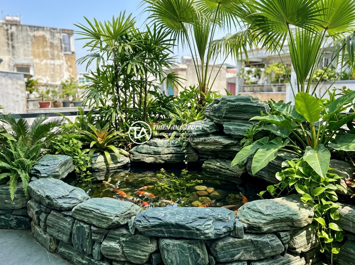 Sắp xếp đá cảnh sân thượng: Cách tạo chiều sâu cho không gian nhỏ - Vibrant tropical Vietnamese rooftop terrace with natural stone borders around a 