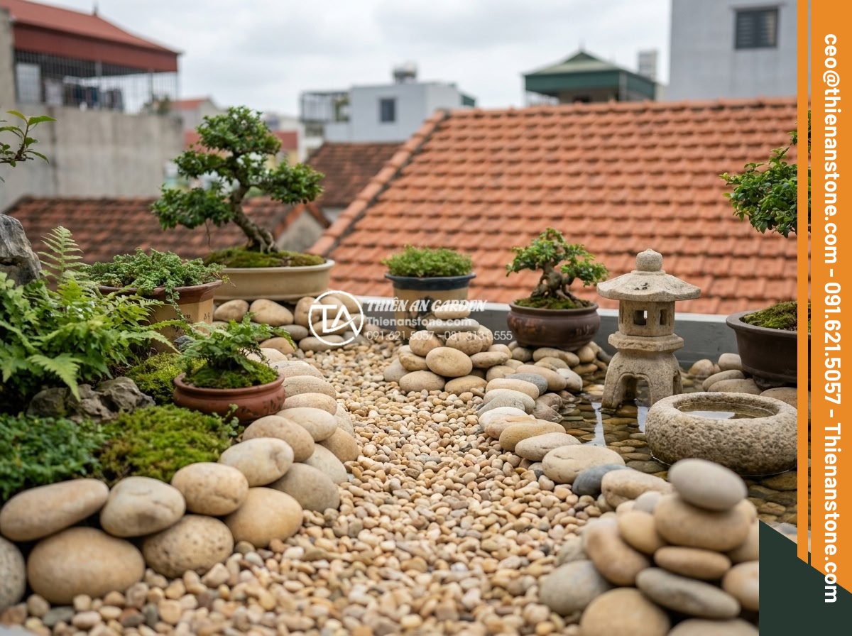 Thiết kế tiểu cảnh sân thượng nhỏ mini cho nhà phố diện tích hẹp - Close-up view of detailed natural stone carvings and polished rock elements arra