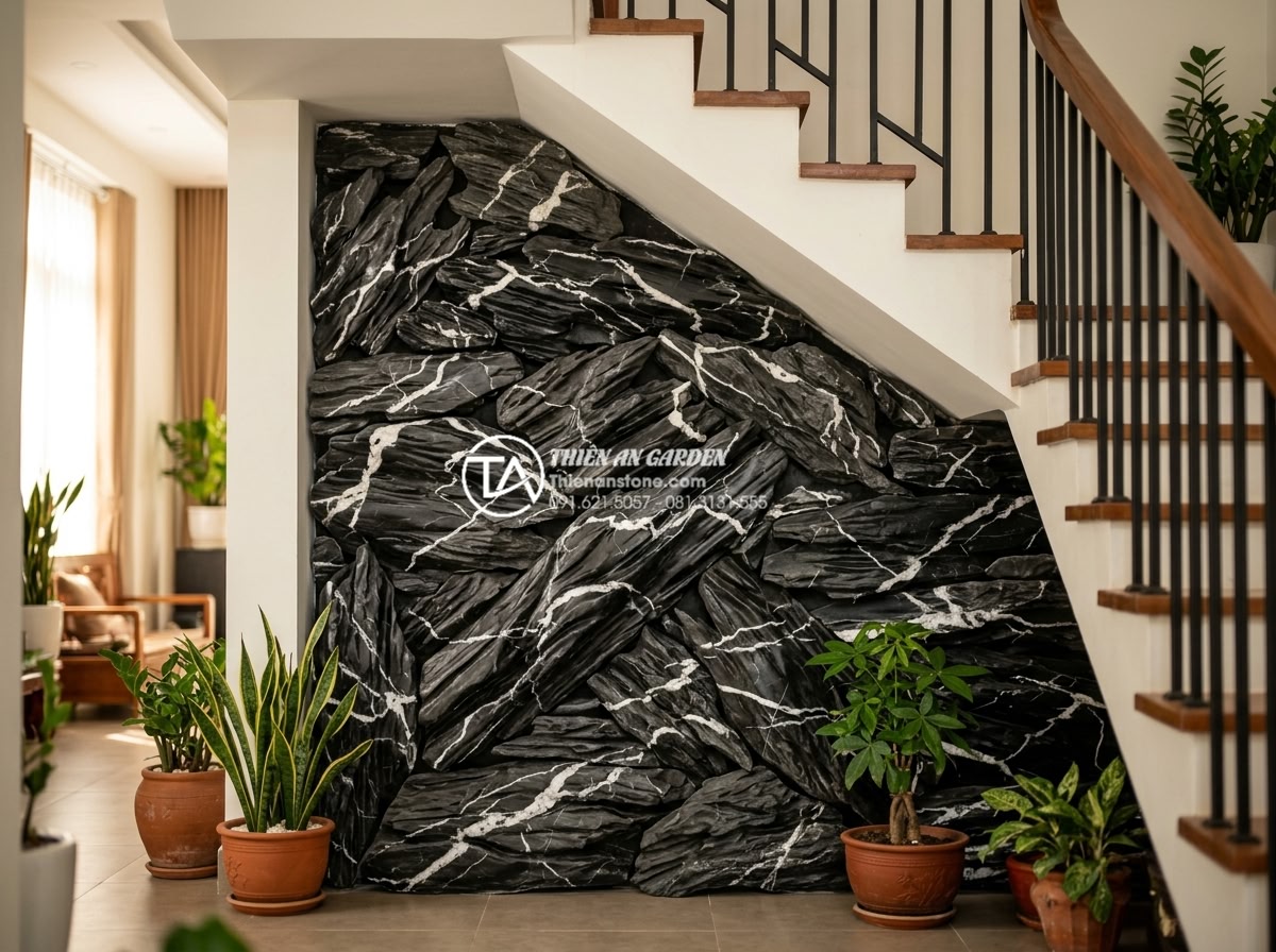 Top 5 loại đá tự nhiên trang trí tiểu cảnh gầm cầu thang đẹp nhất - Multi-colored slate stone arrangement forming natural wall effect under staircas