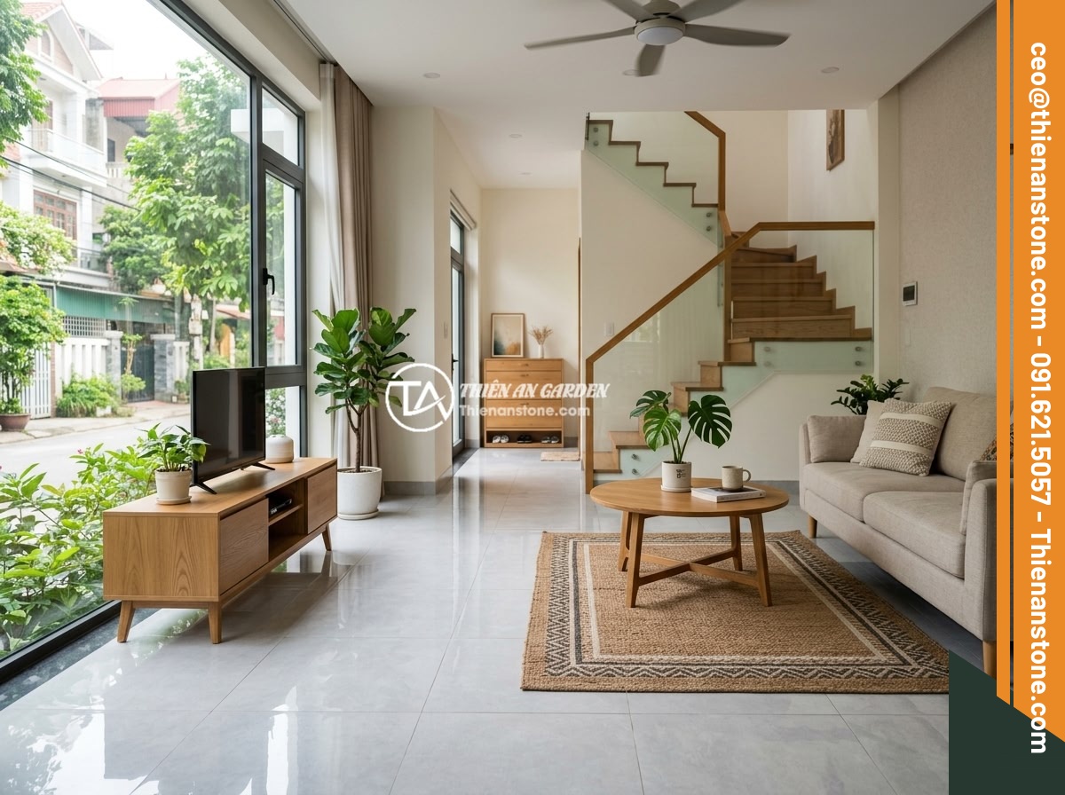 Case Study: Dự Án Nhà Ở Hà Nội Rải Đá Thạch Anh Vụn Dưới Nền Và Kết Quả - Interior view of a completed ground floor living room in a Hanoi townhouse showi