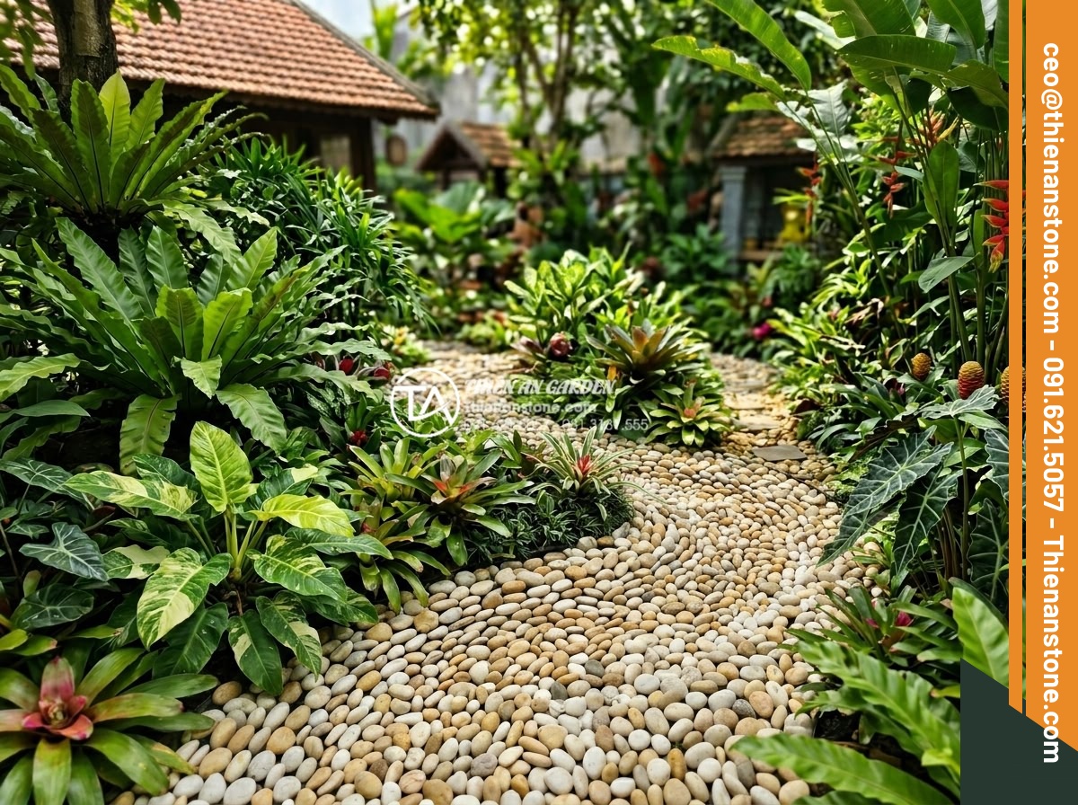 Cách Phối Màu Sỏi Rải Sân Vườn Theo Phong Thủy Bản Mệnh - Vibrant garden featuring green and brown pebbles arranged in flowing patterns su