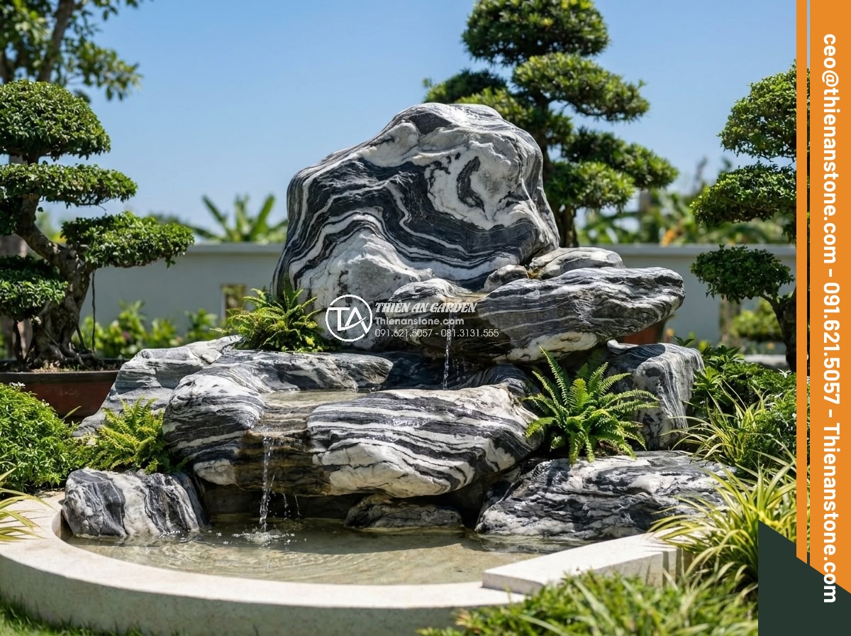 Cách Vệ Sinh Đá Non Bộ Bị Rêu Mốc Sau Nhiều Năm Sử Dụng - Beautifully maintained natural stone non-bo in a Vietnamese luxury villa garden 