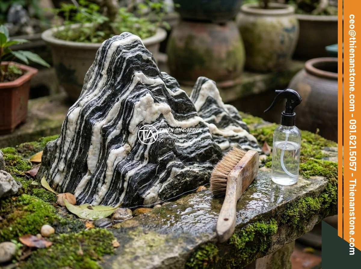 Hòn Non Bộ Đá Tuyết Sơn: Vẻ Đẹp Đẳng Cấp Cho Biệt Thự Sân Vườn - Maintenance process showing gentle cleaning of Tuyet Son stone hòn non bộ to pre