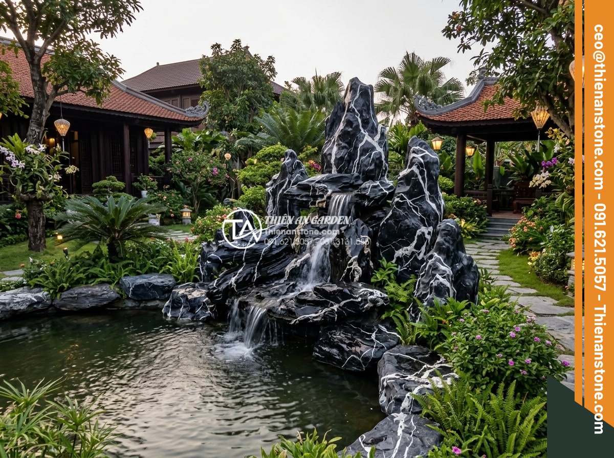 Tại Sao Nên Dùng Đá Thấm Thủy Cho Hòn Non Bộ Có Thác Nước? - Hình 8 Tại Sao Nên Dùng Đá Thấm Thủy Cho Hòn Non Bộ Có Thác Nước? - Panoramic view of luxury villa garden with large scale rockery waterfall entirel