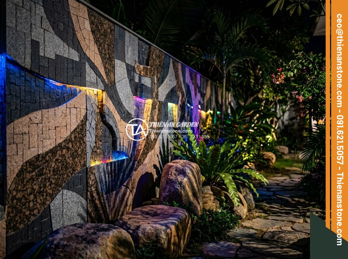 Cách phối hợp đá ghép 4 màu với đèn LED tạo hiệu ứng ánh sáng cực đỉnh - Vibrant nighttime scene of a luxury villa garden featuring 4-color stone mosaic 