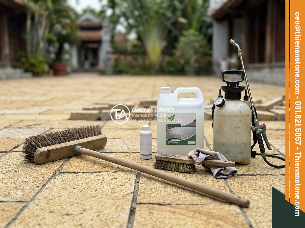 Cách vệ sinh và bảo dưỡng đá cubic lát sân luôn như mới - Professional tools and eco-friendly stone care products laid out for cubic paver