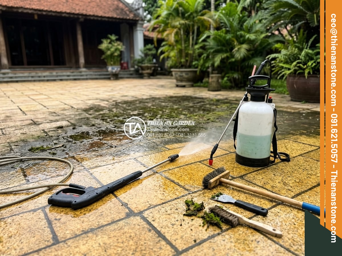 Cách vệ sinh và bảo dưỡng đá cubic lát sân luôn như mới - Professional deep cleaning process on large cubic stone patio showing pressure w