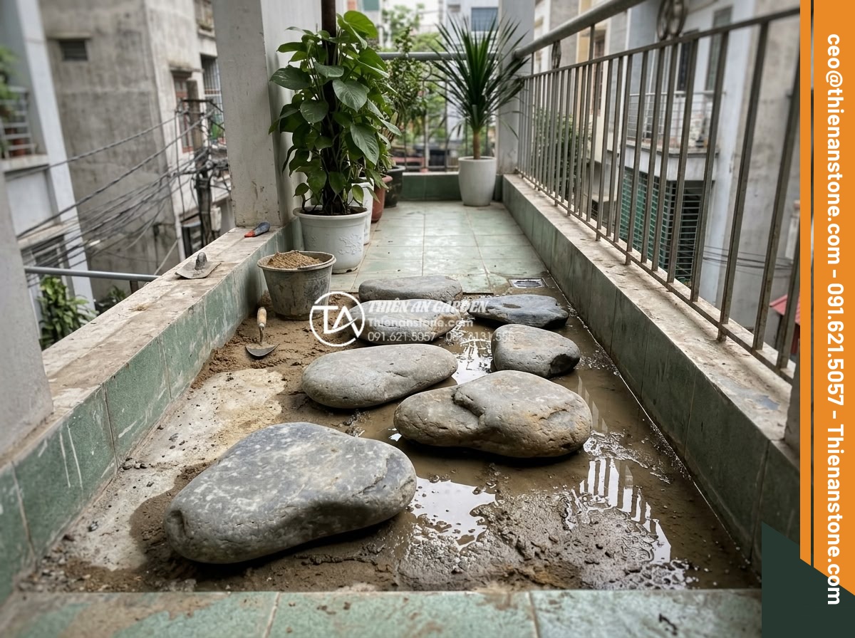 Có nên dùng đá dặm bước cho lối đi ban công chung cư? - Realistic depiction of common installation challenges with stepping stones on a 