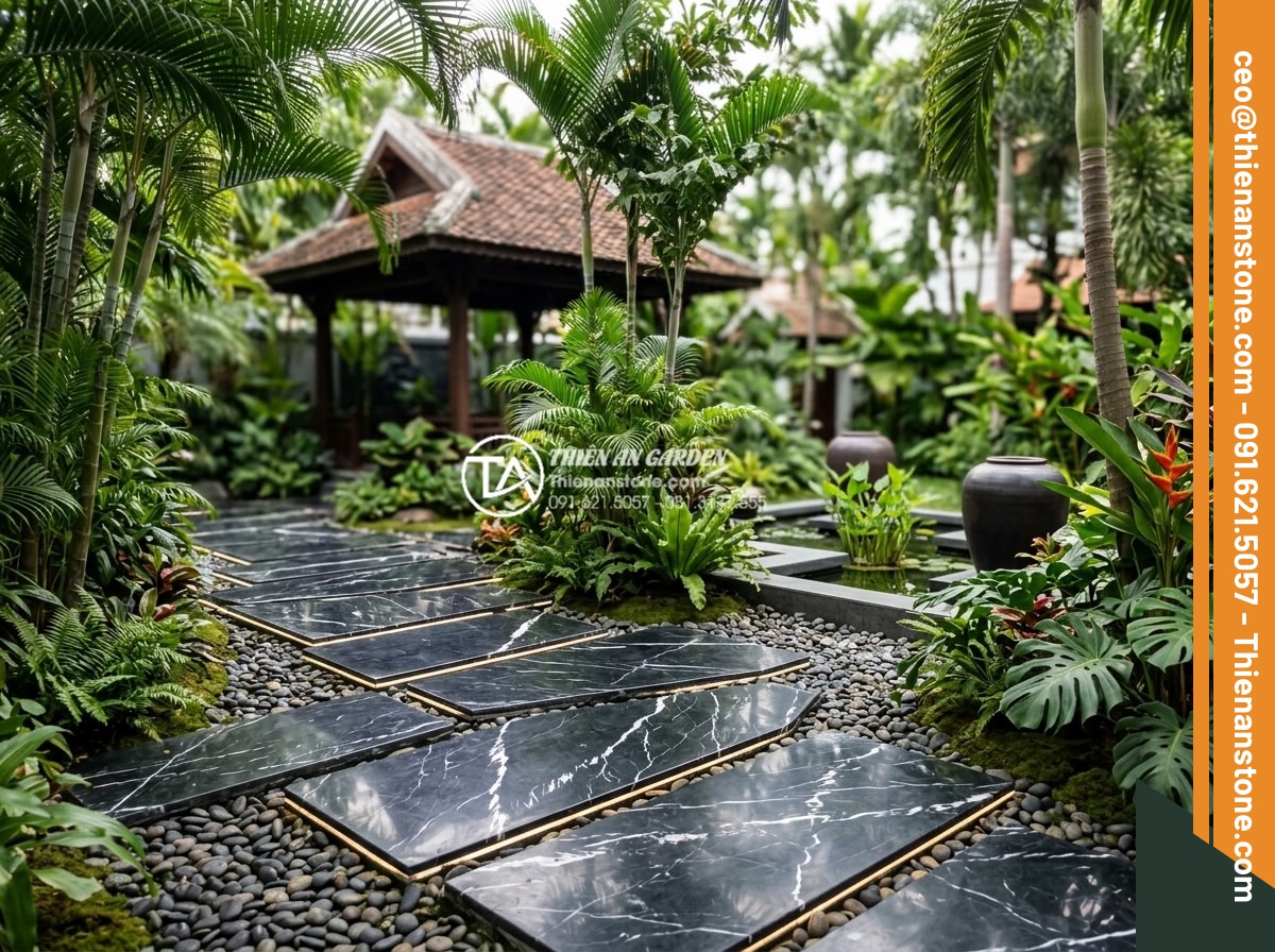 Đá dậm bước là gì? Vai trò và ý nghĩa của lối đi đá trong sân vườn - Hình 4 Đá dậm bước là gì? Vai trò và ý nghĩa của lối đi đá trong sân vườn - Modern Vietnamese garden with contemporary stepping stones made from polished ba
