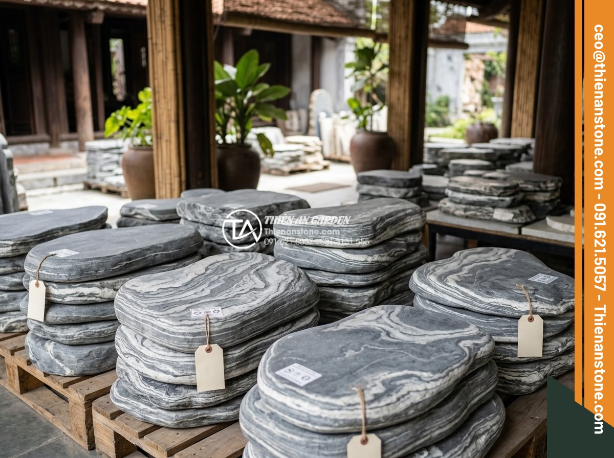 FAQ: Những câu hỏi thường gặp nhất khi chọn mua đá dặm bước - High-quality natural stepping stones stacked with visible price tags and quality