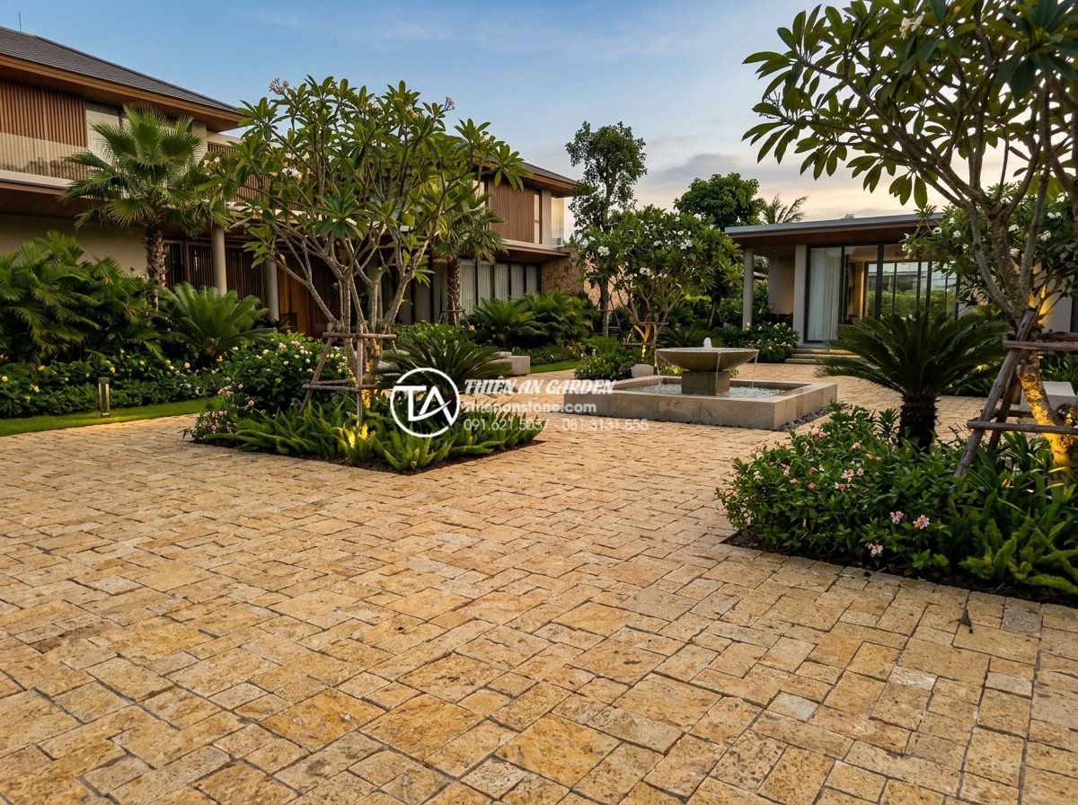 Giá đá cubic phụ thuộc vào yếu tố nào? Bí quyết mua đá chất lượng giá rẻ - Wide angle shot of a luxurious villa garden paved entirely with uniform cubic st