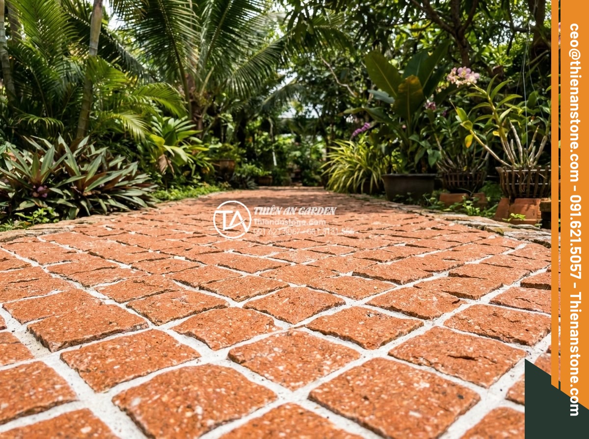 Top 15 mẫu lát đá cubic sân vườn đẹp mắt dẫn đầu xu hướng 2026 - Vibrant red speckled cubic stones with white grout lines forming bold geometric 