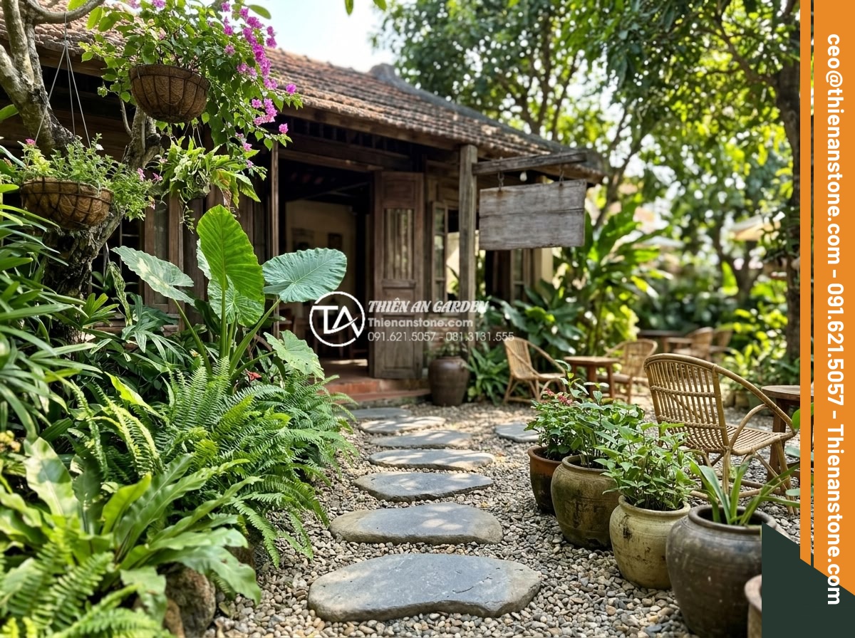 Ứng dụng đá bước dạo trong thiết kế quán cafe sân vườn cực chill - Stepping stones leading to cafe entrance in a garden setting with signage and po