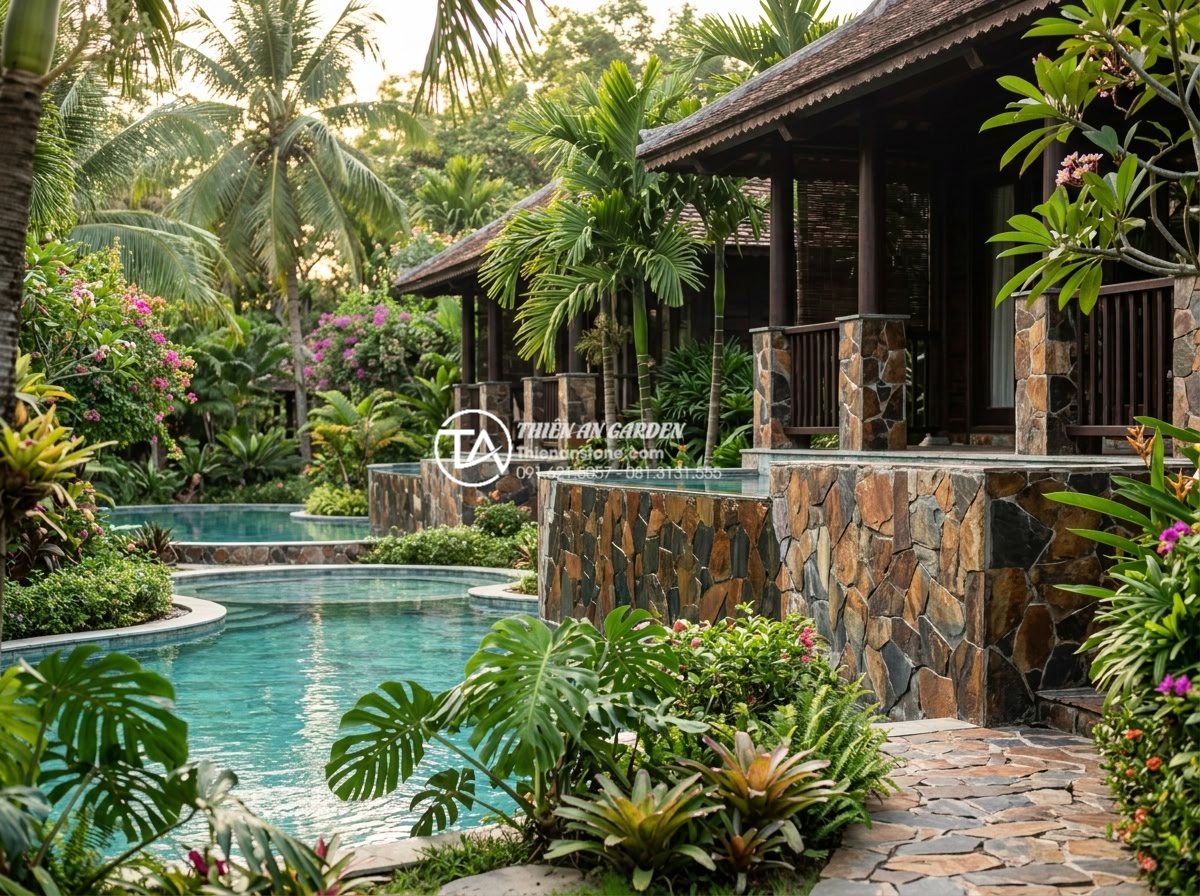 15+ Mẫu đá rối ốp chân tường giúp bảo vệ công trình tuyệt đối - Resort exterior featuring extensive natural pebble cladding on building bases su