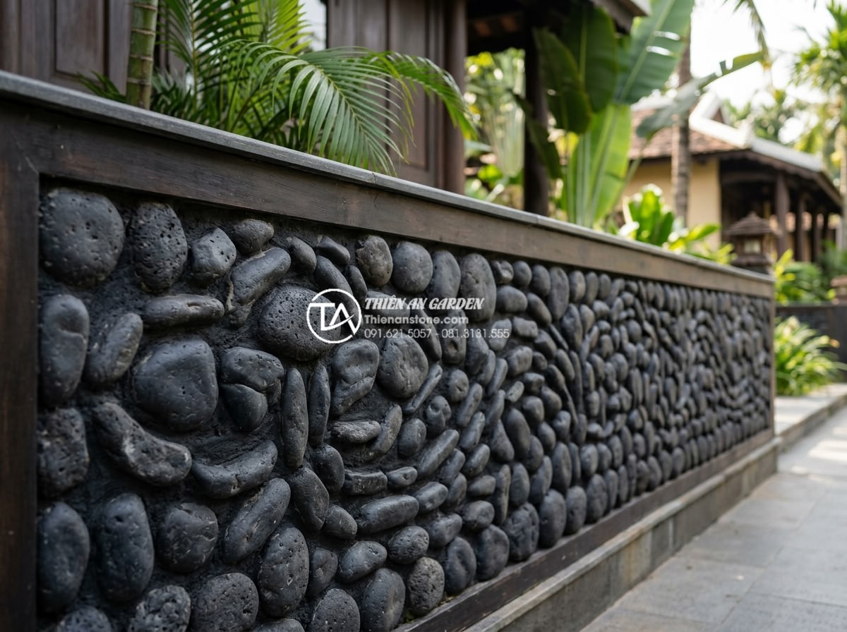 15+ Mẫu đá rối ốp chân tường giúp bảo vệ công trình tuyệt đối - Multi-colored large pebble stones creating artistic pattern on building wall bas