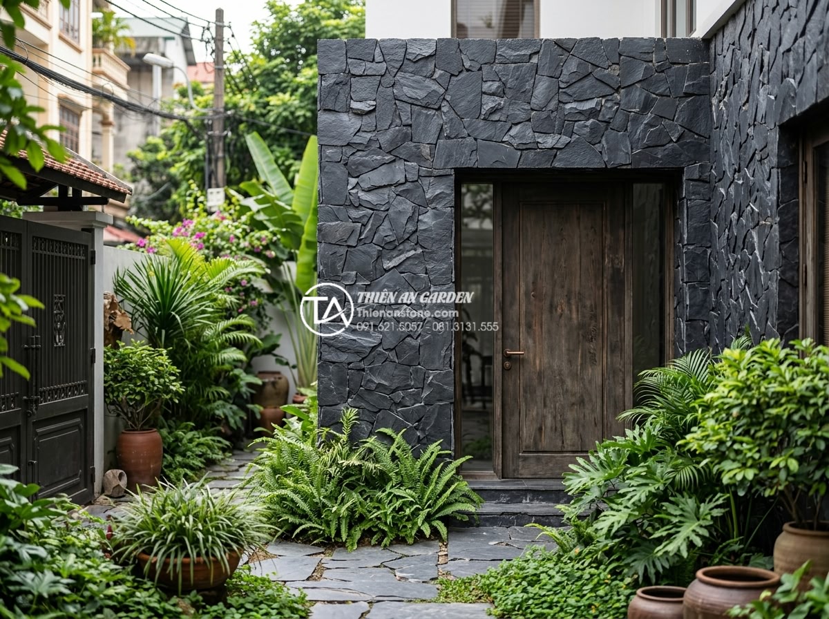 20 Ý tưởng sử dụng đá rối trang trí mặt tiền nhà phố cực ấn tượng - Elegant townhouse entrance featuring rubble stone wall cladding that provides th