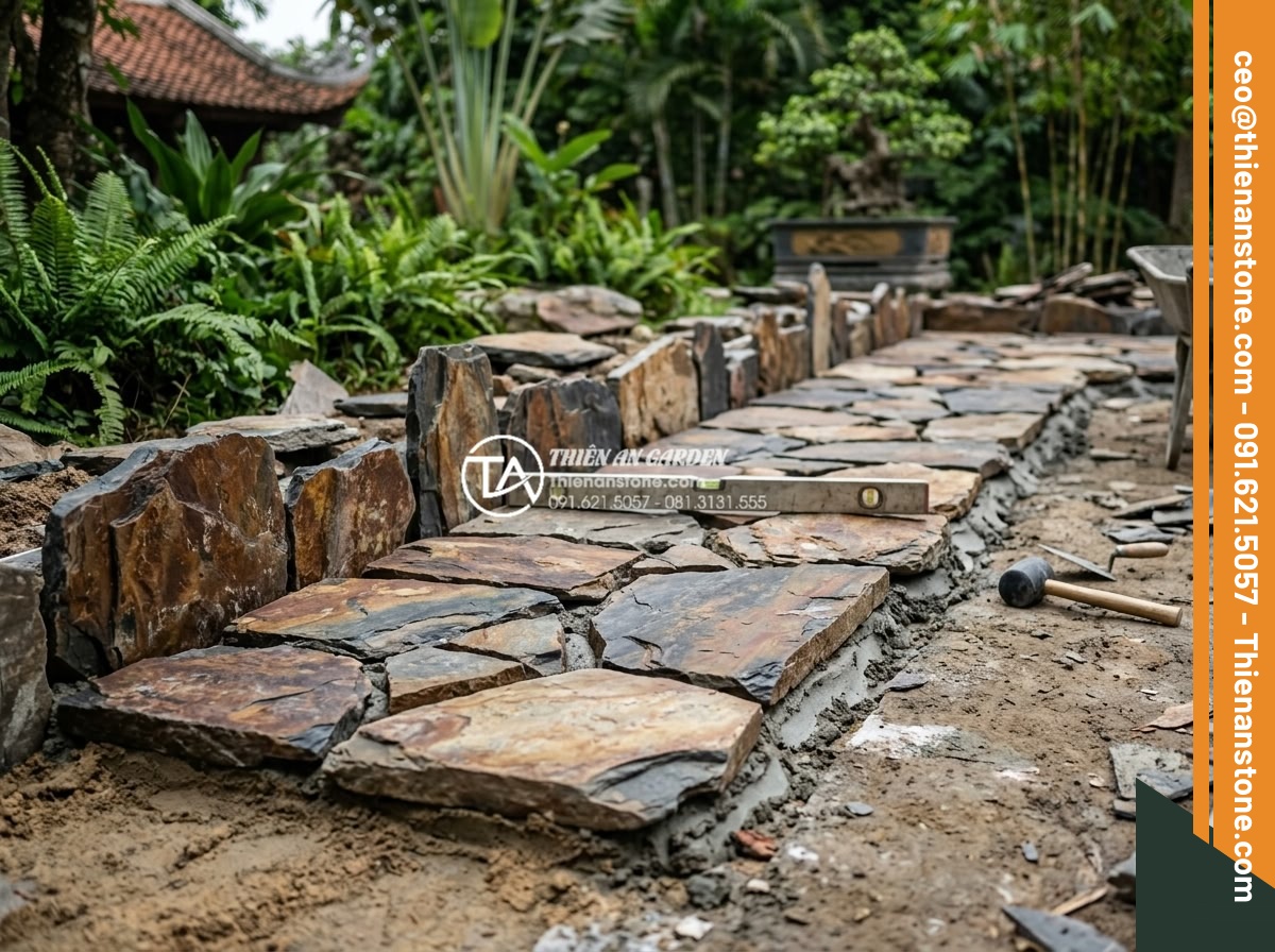Báo giá thi công đá rối trọn gói: Những yếu tố ảnh hưởng đến giá - Team of skilled stonemasons carefully placing and leveling natural chaotic stone